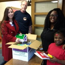 Kay Emmert (President) and Dennis Dullea (Stewards Council Chair) present school supplies to a fantastic teacher and student at Wiley Elementary School.